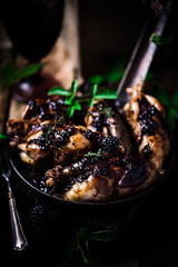 Quail with blackberry sauce.darck rustic photo