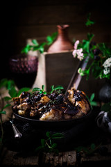 Quail with blackberry sauce.darck rustic photo