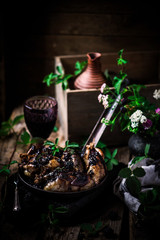 Quail with blackberry sauce.darck rustic photo