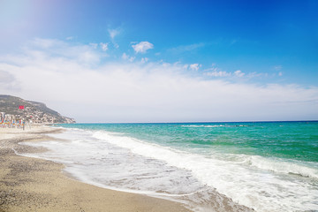 Pebble beach and blue sky on background