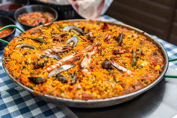 huge Paella pan plate with seafood and rice traditional Spanish food
