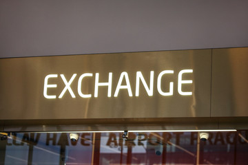 Money Exchange desk at departure hall (Vaclav Havel Airport, Prague, writing visible below). Detail on neon text.