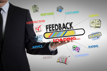 Feedback, Business concept. Chart with keywords and icons. Man holding a tablet computer