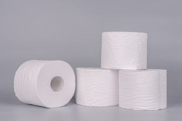 Toilet paper rolls on light grey color background.