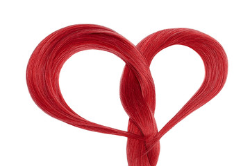 Long red hair in shape of heart on white background. Hair care concept 