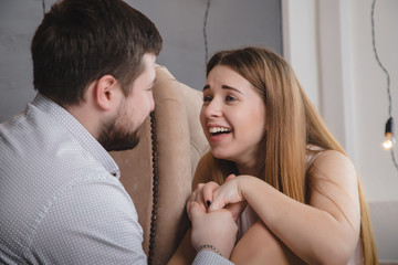 Lovely couple have fun and relax at home together