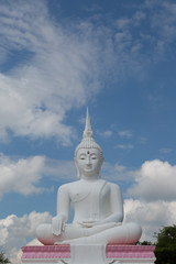 Grand White Buddha on blue sky background