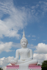 Grand White Buddha on blue sky background