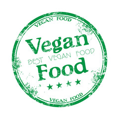 Green grunge rubber stamp with the text vegan food written inside the stamp