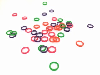 Elastic rubber band for teeth on white background.