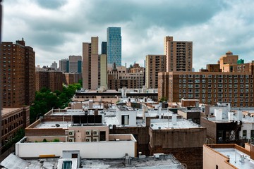 Aerial New York City skyline view above rooftops