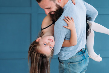 playful family leisure. father love expression. dad holding his little girl in his hands. cute...