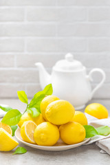 Fresh lemons with lemon leaves