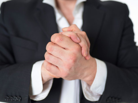 businessman shaking hands. he wear in suit. Isolated on whitr