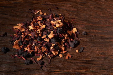 Still life, aromatic dry tea with fruits and petals, close up on white background, selective focus