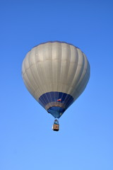 Fototapeta premium Hot air balloon in air, blue sky