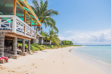Manase Beach, Savai'i, Samoa, South Pacific - fale tourist accommodation next to sand and blue sea