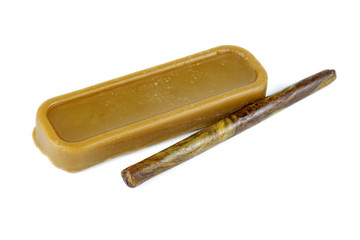 Brick of beeswax and stick of propolis