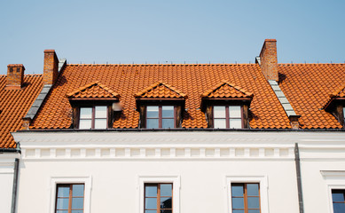 Old historic tenement roof with orange slates