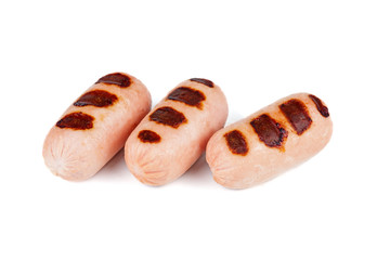 Three small grilled sausages
