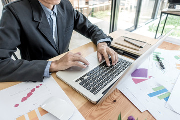 Businessman working at business office table. Selective focus.