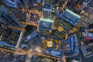 Modern architecture buildings at night aerial view located in the heart of the financial centre - obrazy, fototapety, plakaty