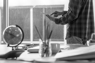 Man using iPad at business office room. Selective focus.