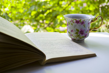 A cup of tea and a book.