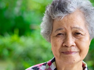 Close-up face of beautiful smiling senior woman.