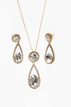 beautiful women jewelry set necklace and earrings on white