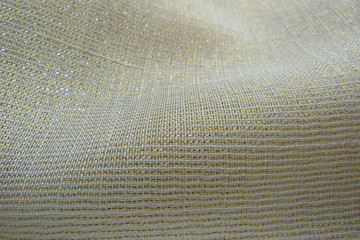 gold brocade fabric close-up natural linens creases padding oriental luxury shiny threads vintage...