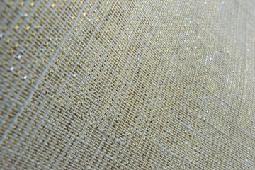 gold brocade fabric close-up natural linens creases padding oriental luxury shiny threads vintage organza curtains background for decor textured material uneven surface silk