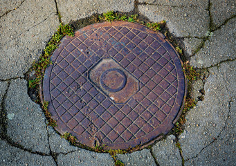 rusty sewer hatch