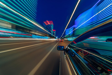 View from Side of Car moving in a night city