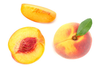 peach fruit with green leaf and slices isolated on white background. top view