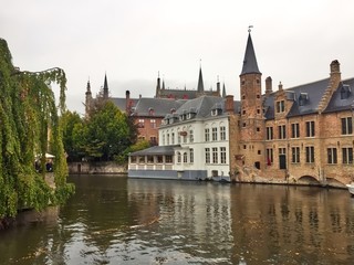 Canal in bruges belgium in autumn 