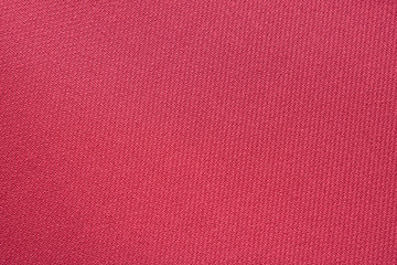 Fototapeta premium crimson textile background.Fabric surface