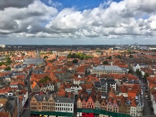Naklejka premium Aerial view from the belfry over bruges belgium on sunny day with red rooftops 