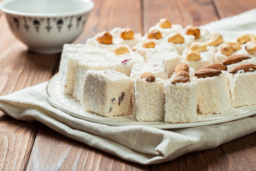 Turkish delight on a wooden table.
