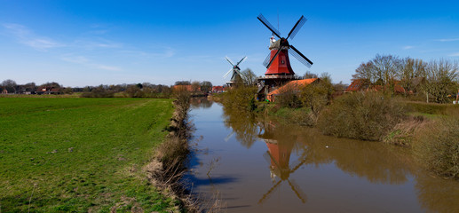 Fototapeta premium the beautiful greetsieler twin mills in the evening light