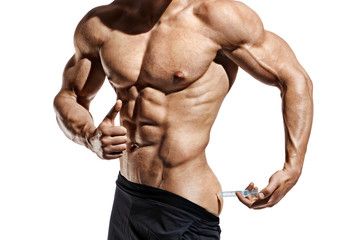 Fototapeta na wymiar Bodybuilder makes an injection of vitamins. Photo of sporty man with perfect physique showing gesture like thumb up on white background. Close up. Strength and motivation