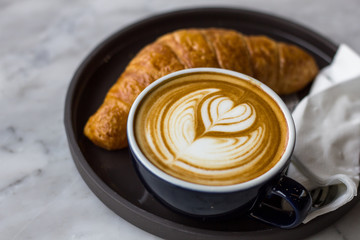cup of coffee with whipped cream on a white background