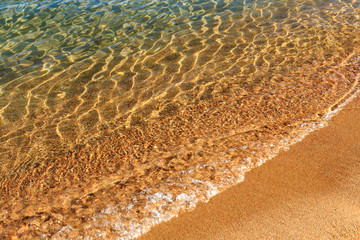 Blue clear water. Sea, lake, sun, beach, vacation Background for inserting images and text. Tourism, travel.