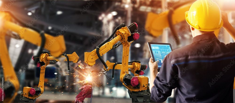 Aufkleber Engineer check and control welding robotics automatic arms machine in intelligent factory automotive industrial with monitoring system software. Digital manufacturing operation. Industry 4.0