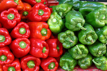 Obraz na płótnie Canvas Close up fresh green and red bell peppers