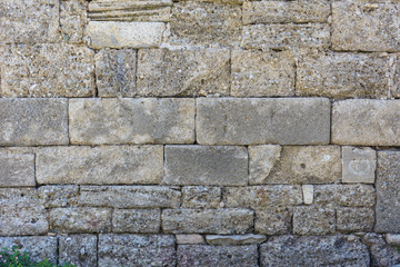 background of large blocks of Sandstone bricks of different size. old antique wall