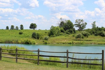 A view of the country landscape and the lake on sunny day