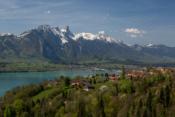 Switzerland - panoramic view from a hill down onto blue lake and the city of Thun with snowtopped mountain in the background.jpg