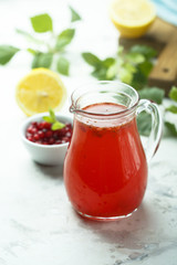 Fototapeta na wymiar Homemade refreshing red berry drink