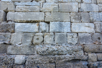 solid background of large blocks of Sandstone bricks of different sizes. the old Roman city wall